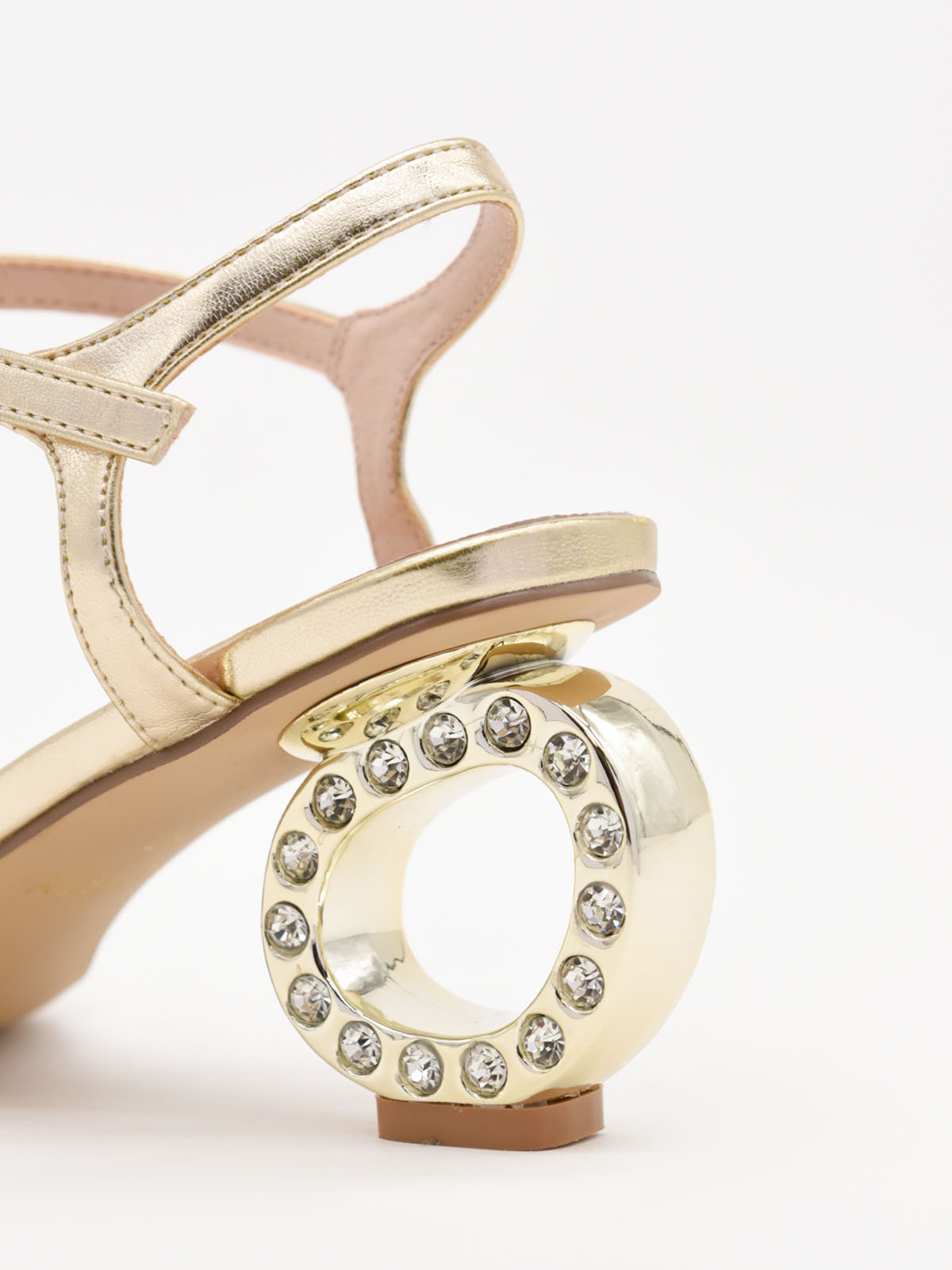 Low-heeled gold sandals with crystal detail