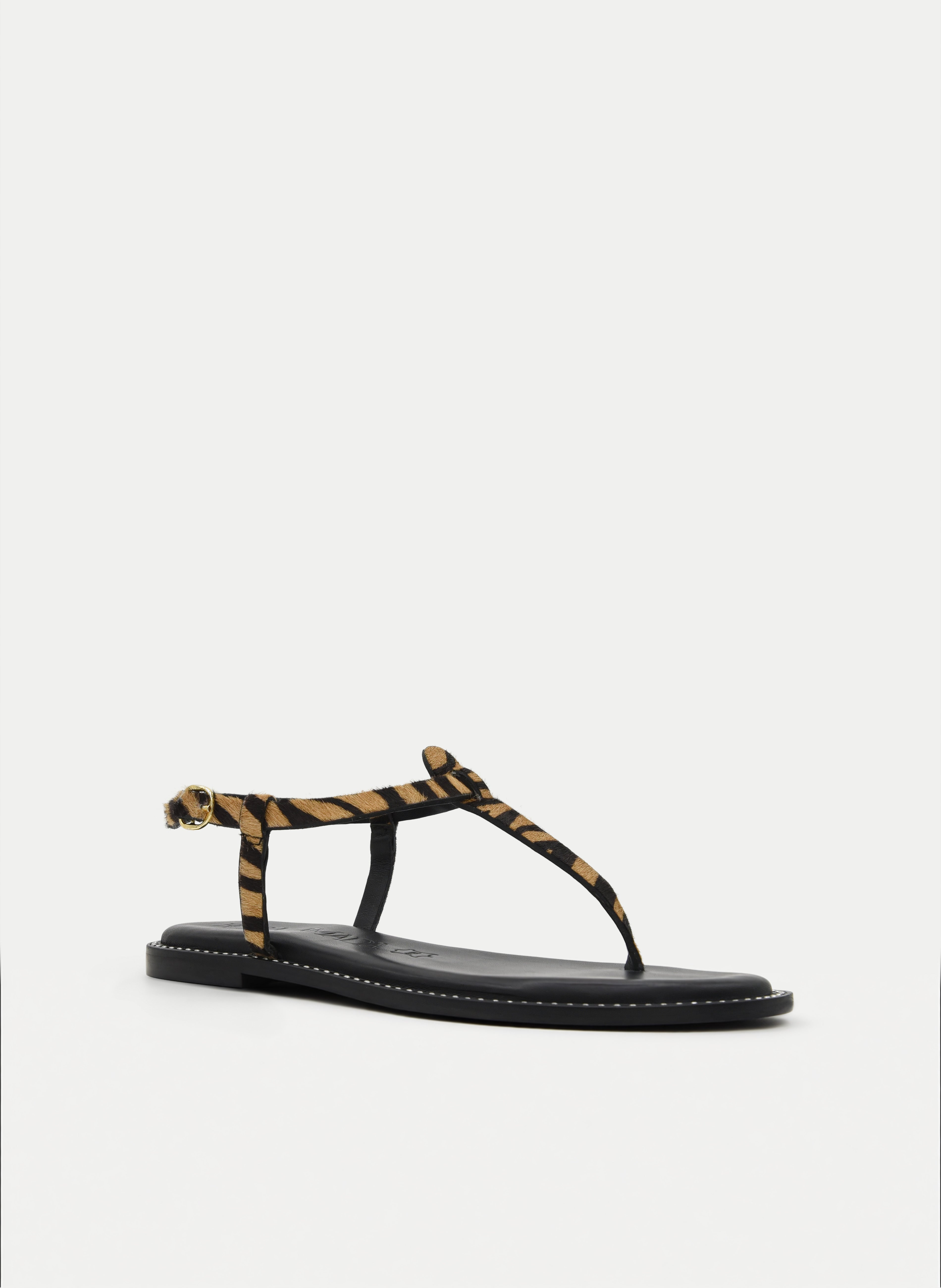 SANDALIA DE PIEL PLANA DEDO CON ANIMAL PRINT CEBRA