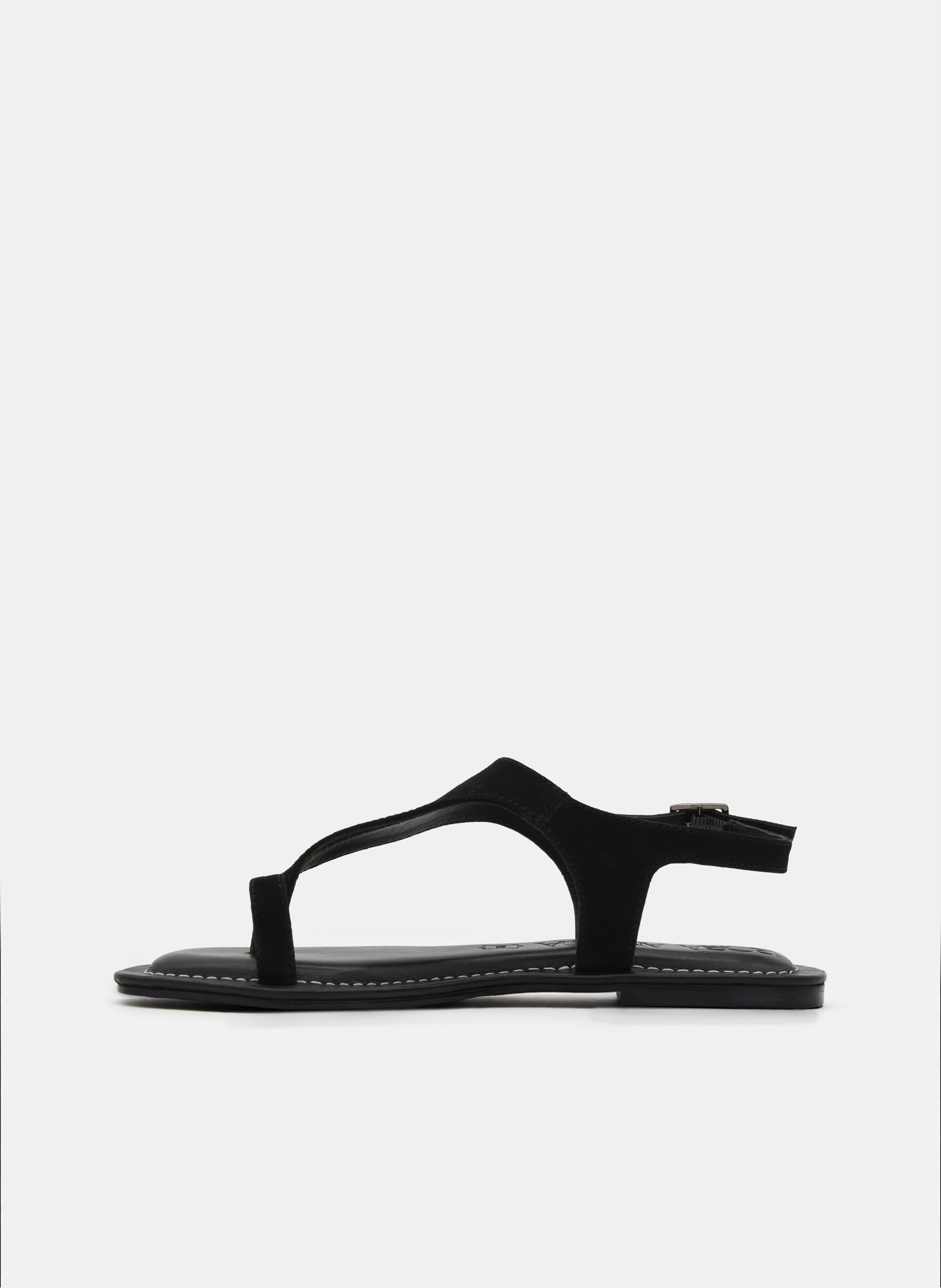 SANDALIAS DE PIEL PLANAS NEGRAS DE DEDO CON HEBILLA